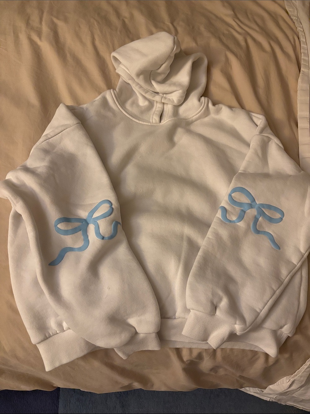 Edikted White Hoodie with Light Blue Ribbon Sleeve Prints